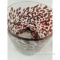 Leopard melihat pemegang lilin silinder